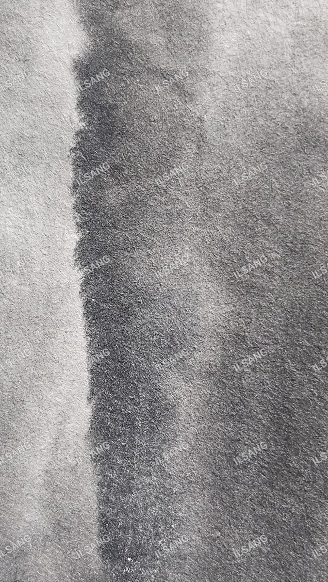 A black and white photo of a gray cloth with a watermark.