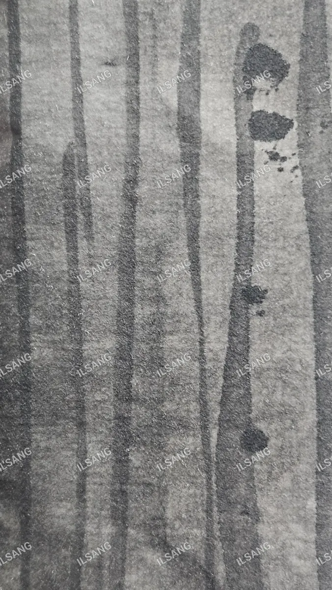 A black and white photo of a tree with a black spot on it.