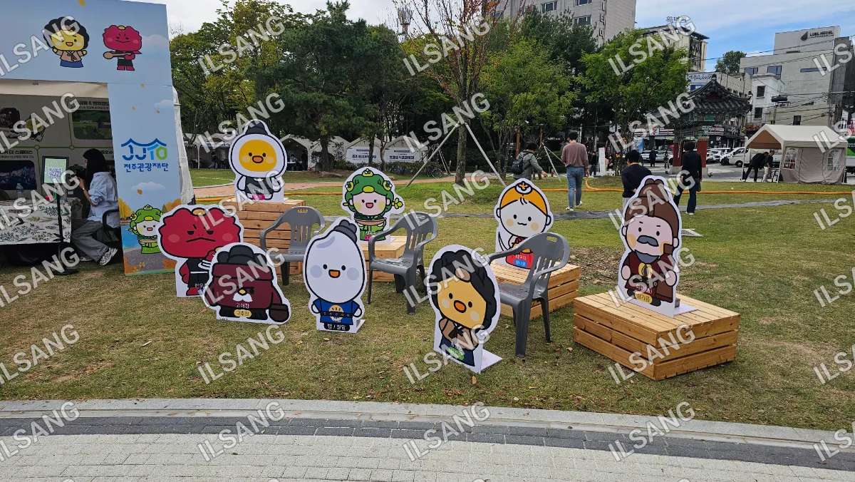 A collection of cartoon characters are displayed on a patio.