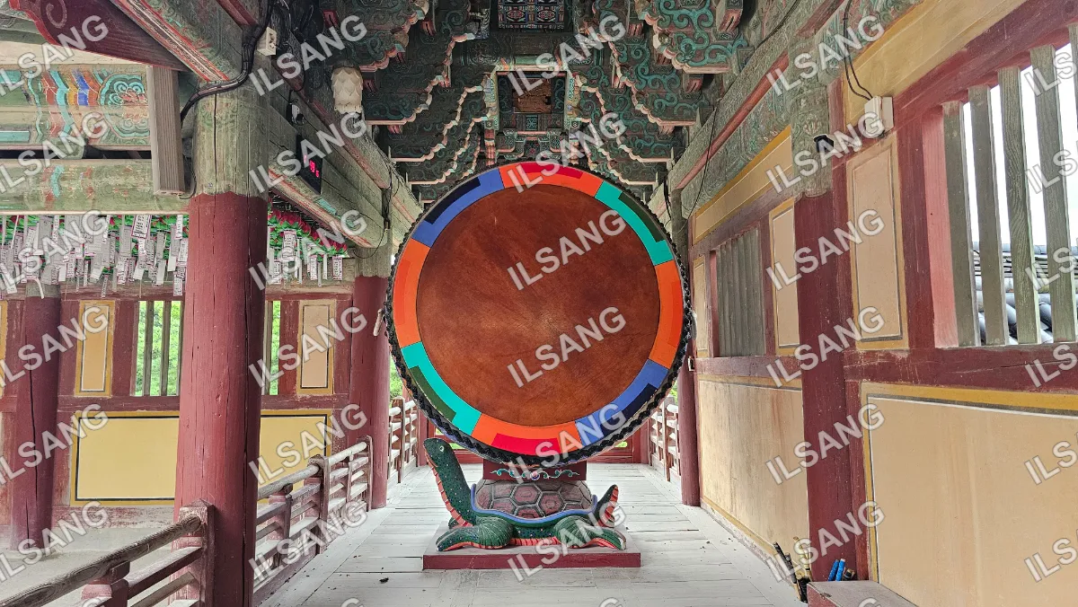A colorful wooden circle is displayed in a building.