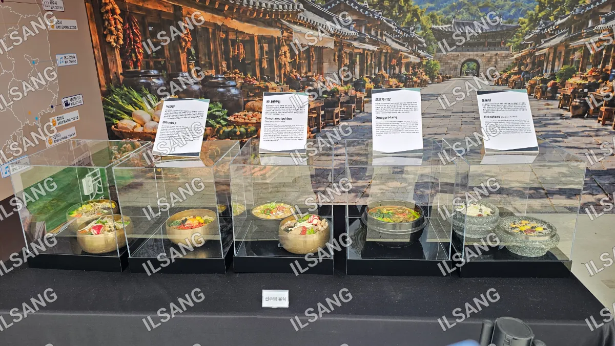 A display of food in glass cases.