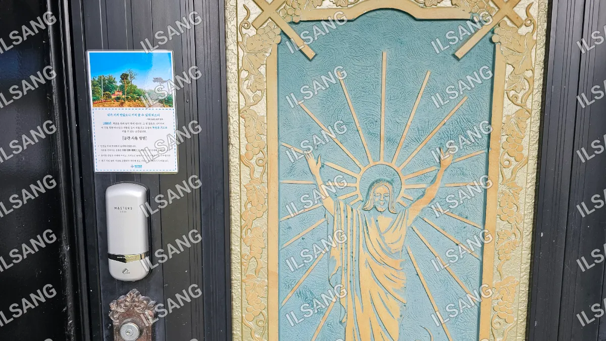 A doorway with a picture of Jesus on it.