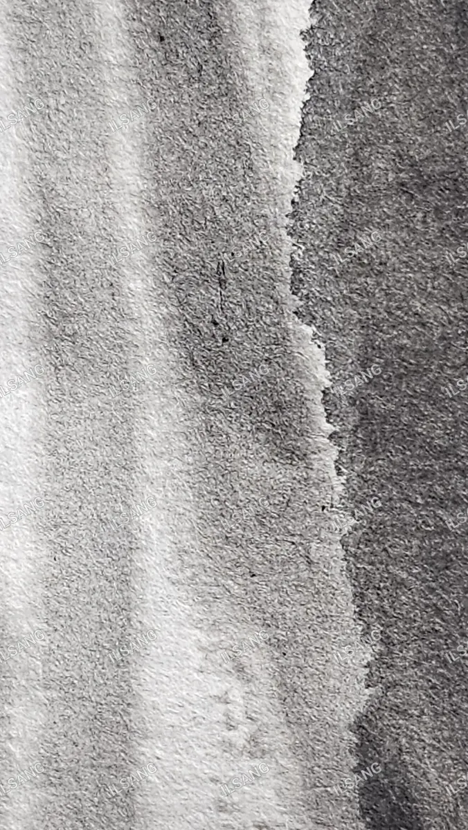 A gray and white cloth with a tear in it.
