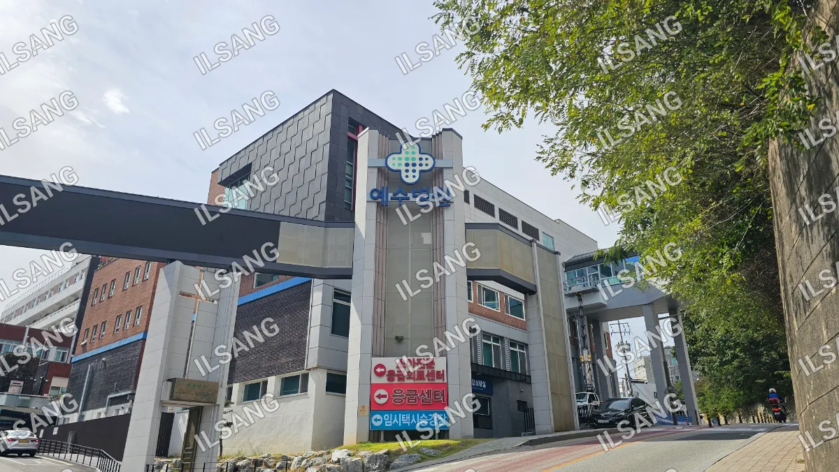A large building with a cross on the top of it.