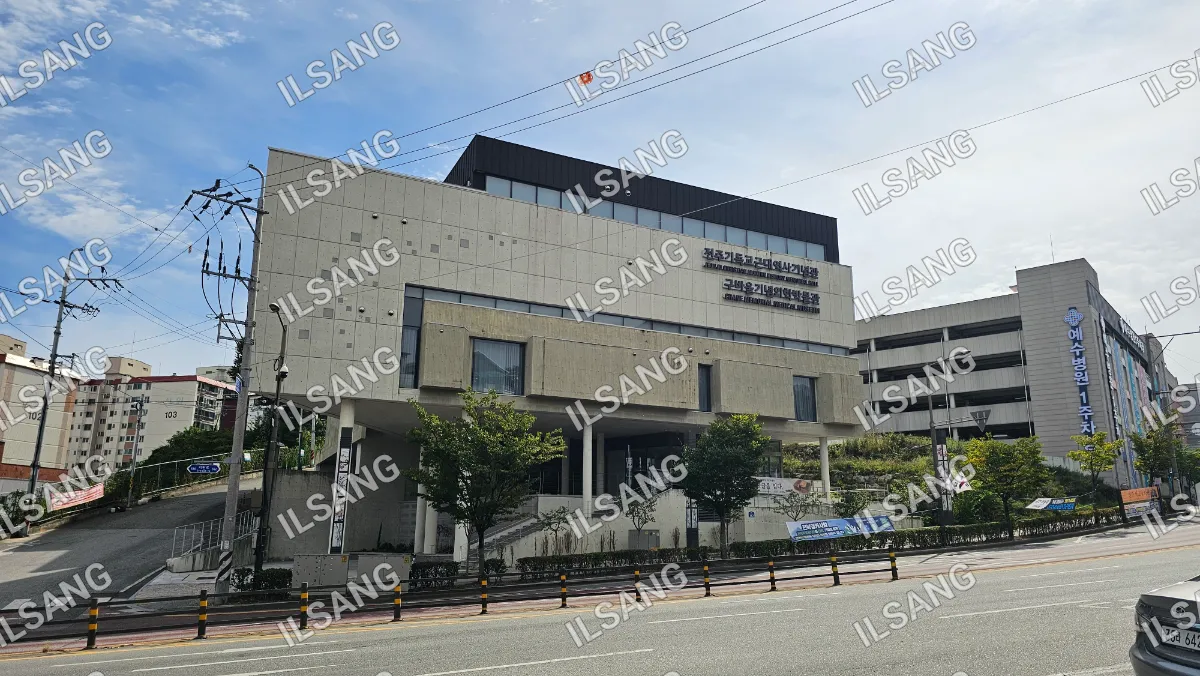 A large building with a sign on the side of it.