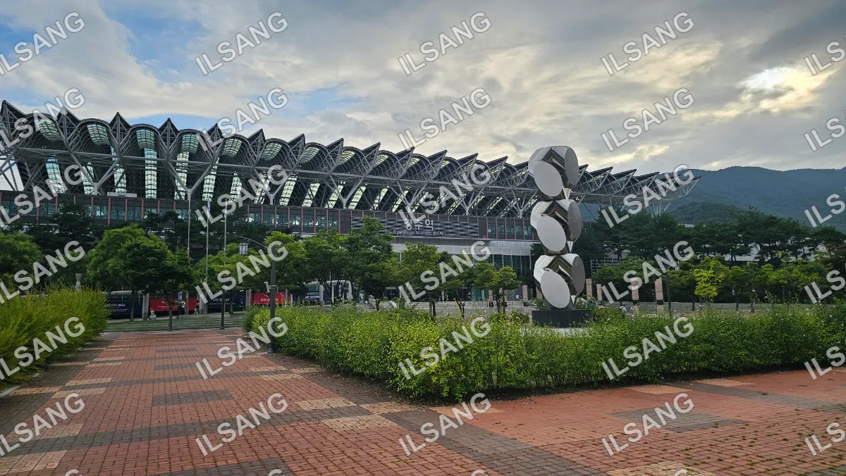 A large building with a statue in front of it.