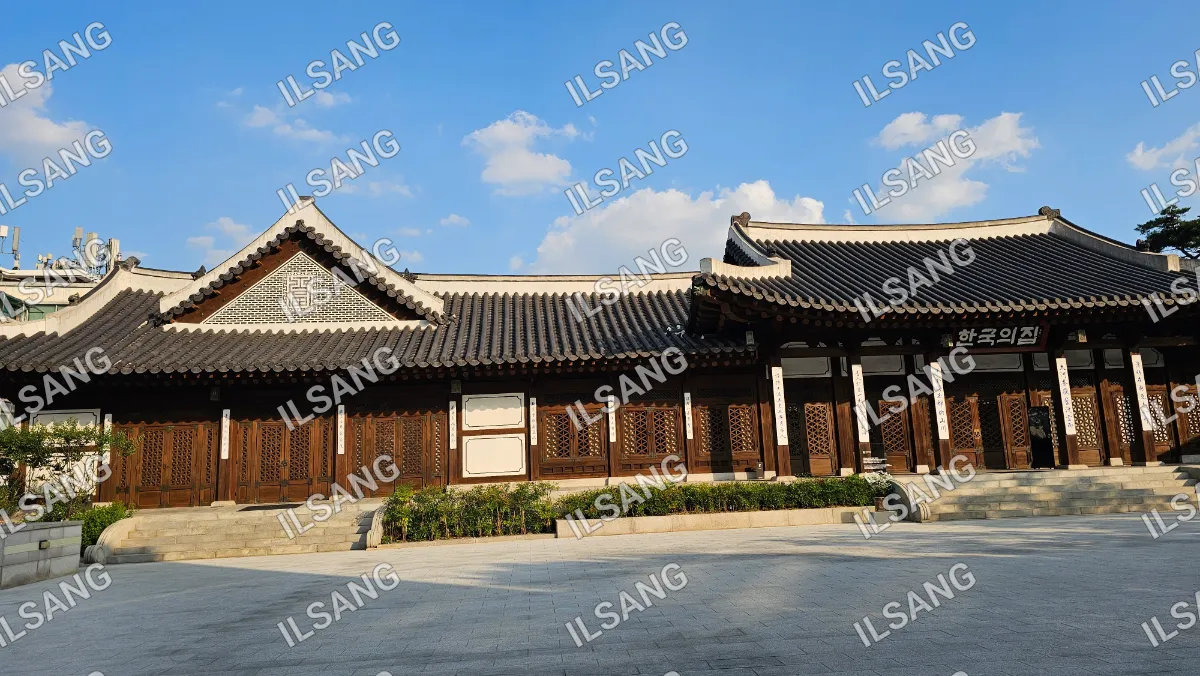 A large building with a tiled roof and many windows.