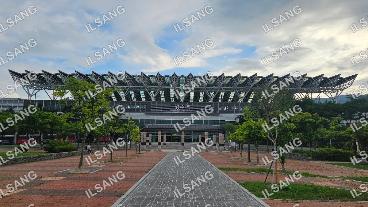 A large building with a walkway in front of it.