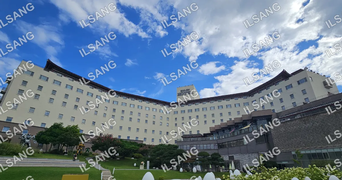 A large white building with a blue sky above it.