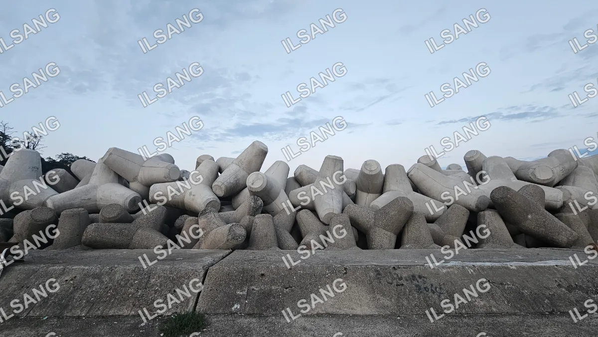 A pile of cement blocks are stacked on top of each other.