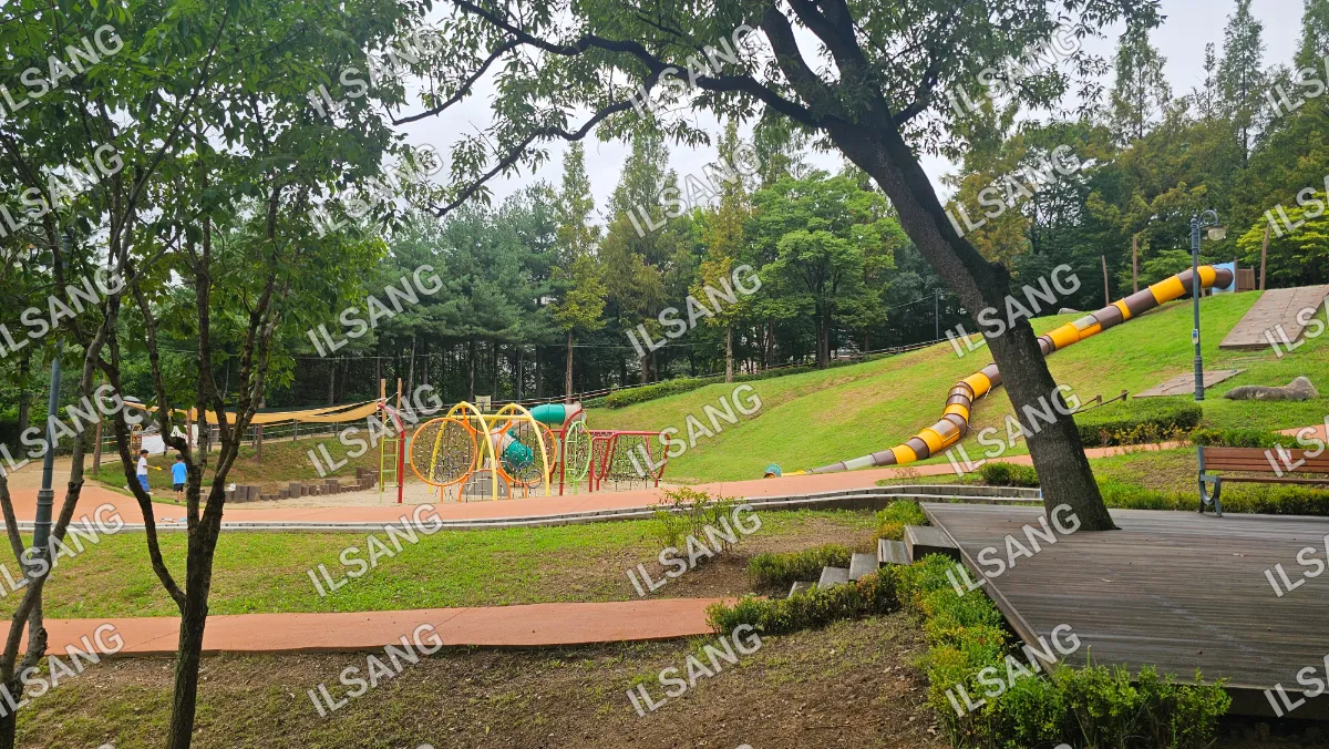 A playground with a slide and a swing.