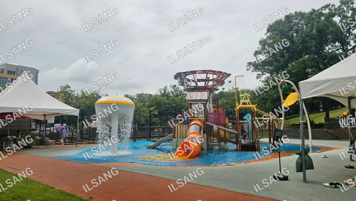 A playground with a slide and a water feature.