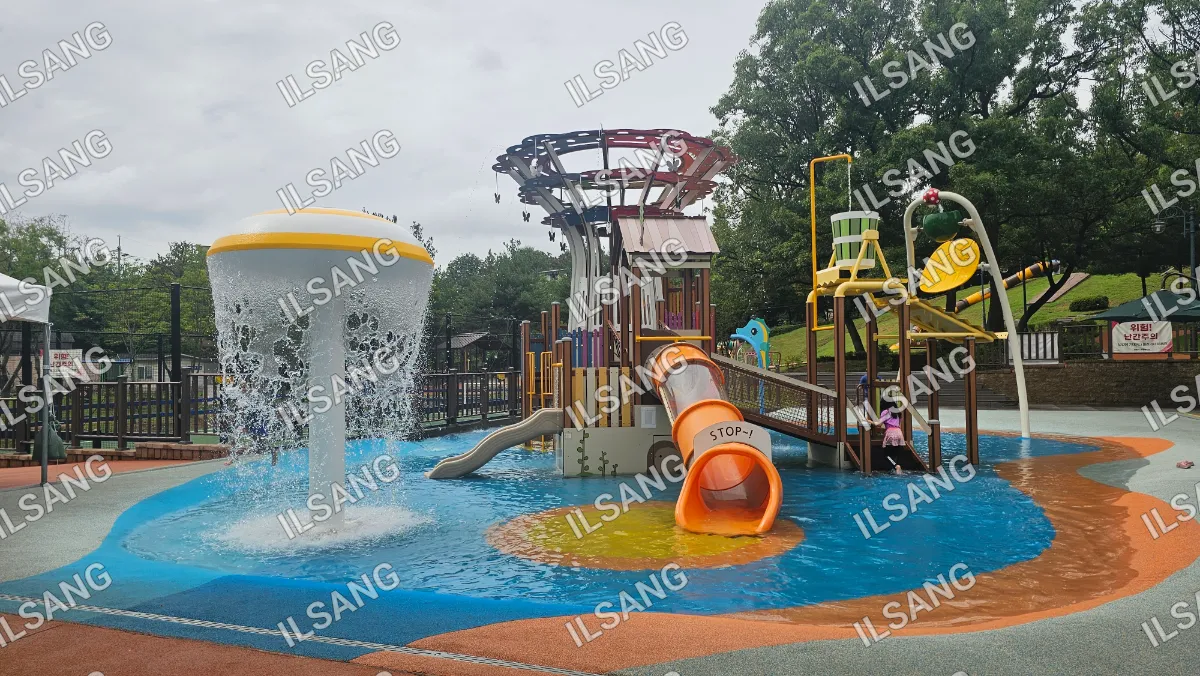A playground with a slide and a water play area.