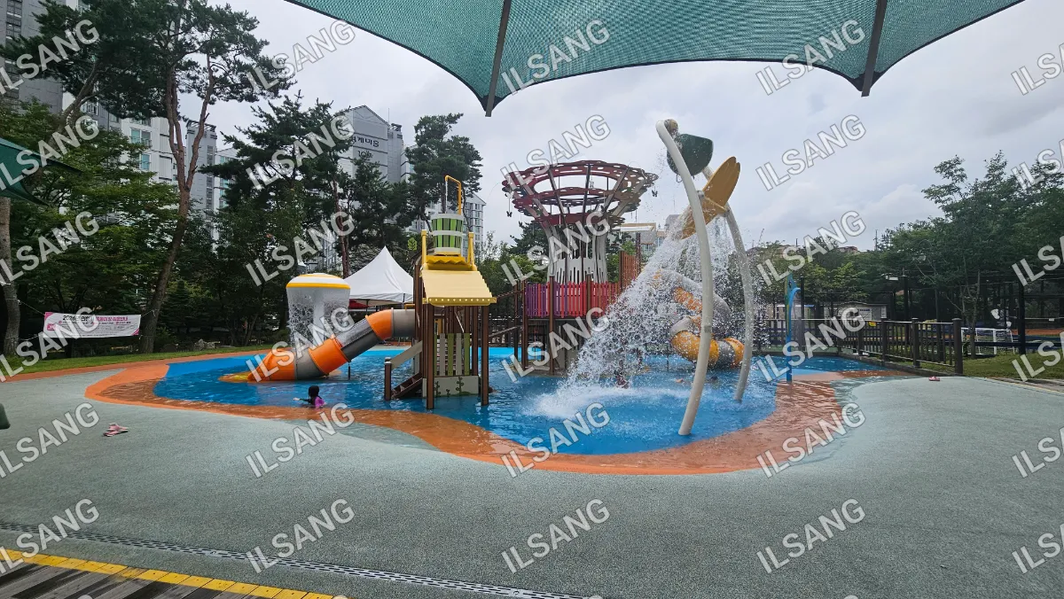 A playground with a water slide and a yellow slide.