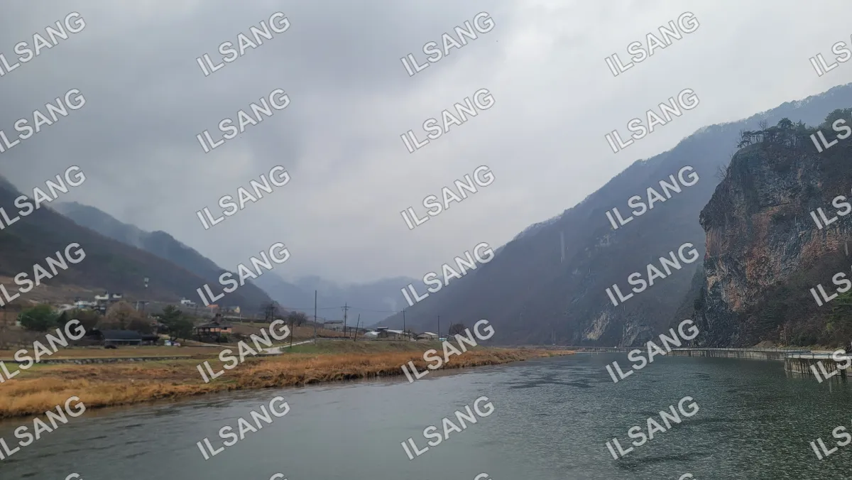 A river with mountains in the background.