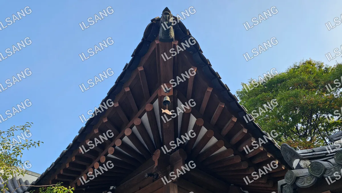A roof with a bell on it.