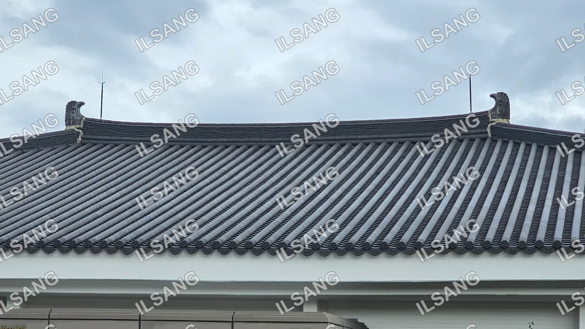 A roof with a gray metal covering.