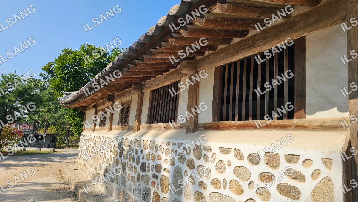 A stone building with a wooden roof.