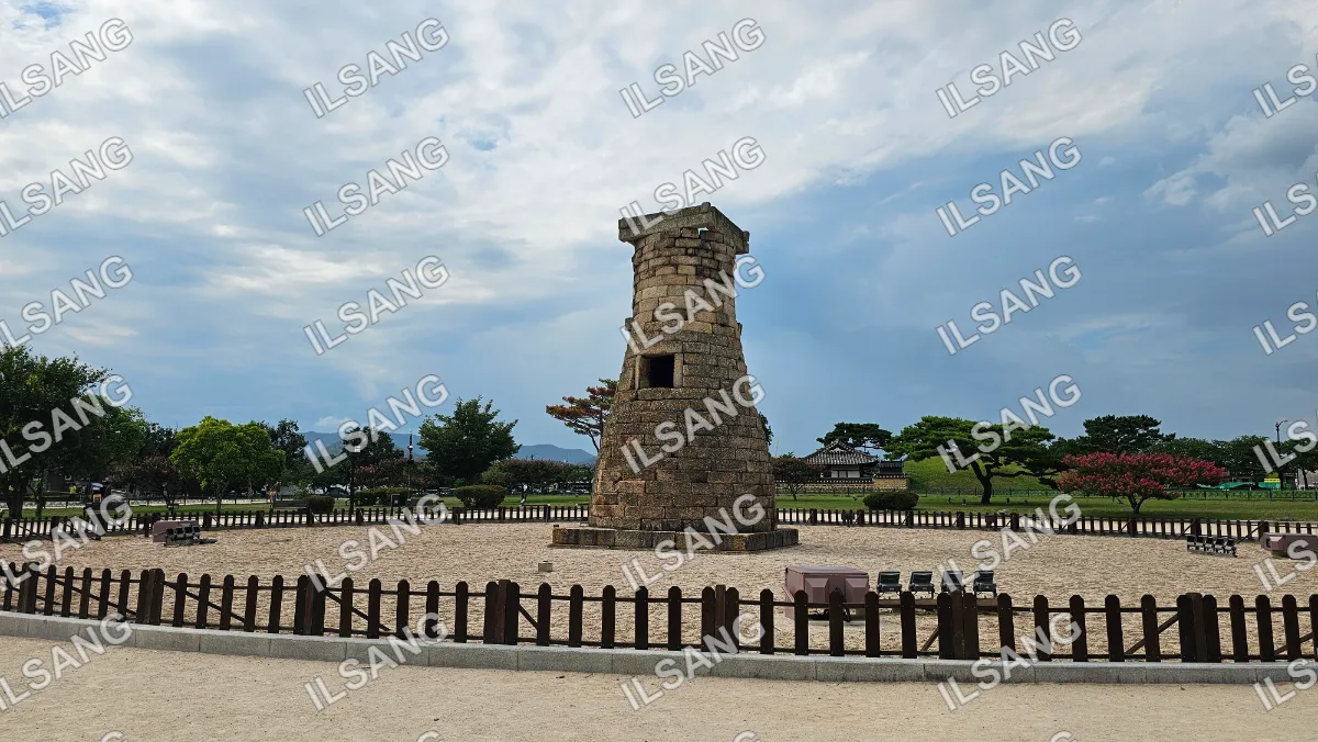 A stone tower with a brick base and a stone top.