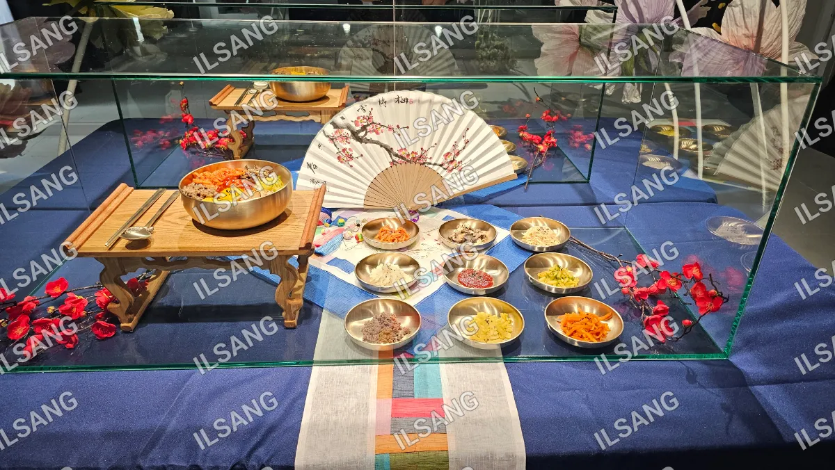 A table with a variety of foods and a fan.