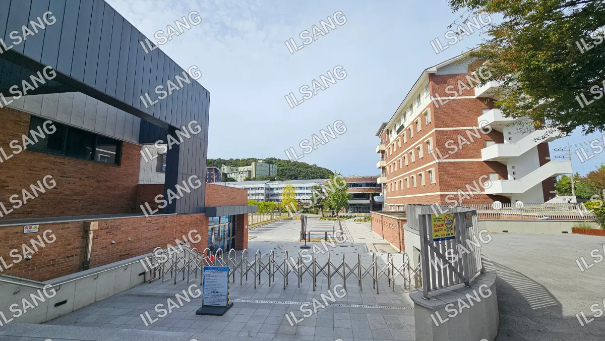 A view of a building with a fence in front of it.