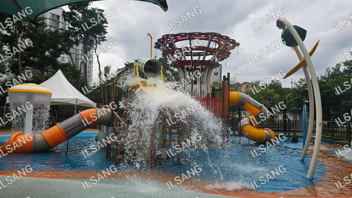 A water slide with a waterfall and a yellow slide.
