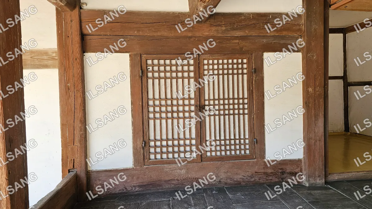 A wooden door with a lattice design.