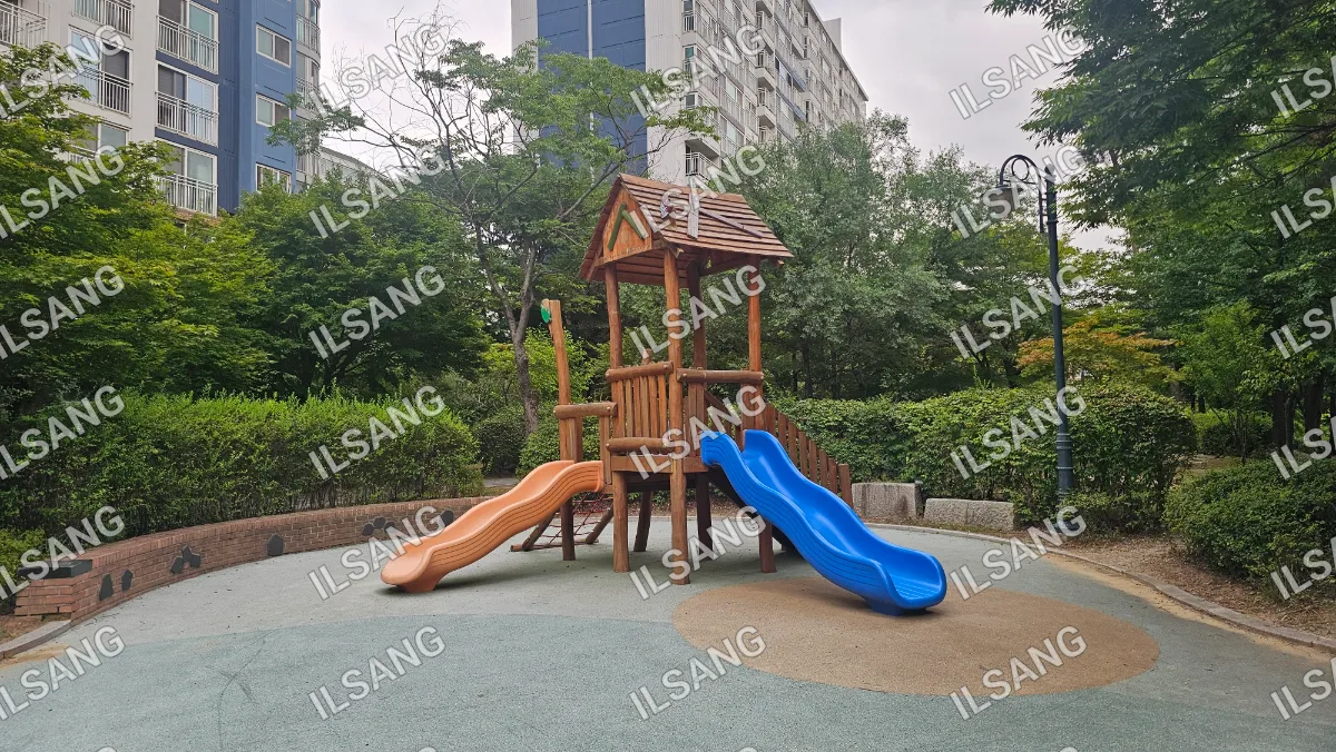 A wooden playground slide with a blue slide on top of it.