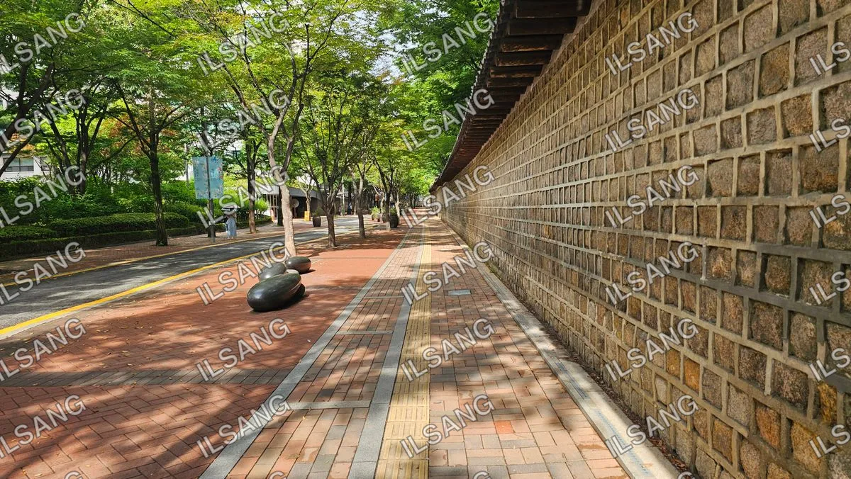 A brick wall with a yellow line on it.