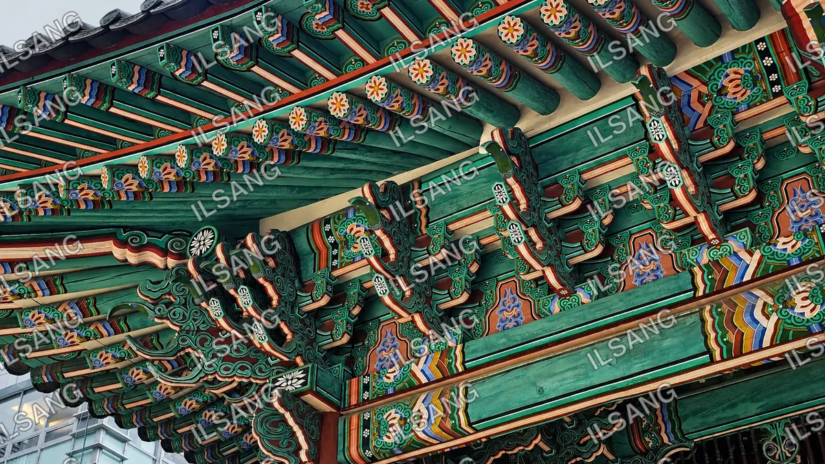 A green and red building with a lot of decorative designs.