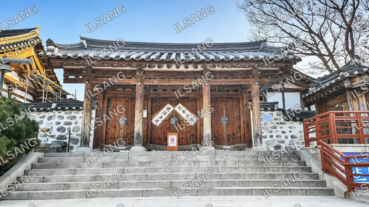 A wooden building with a sign on the door.