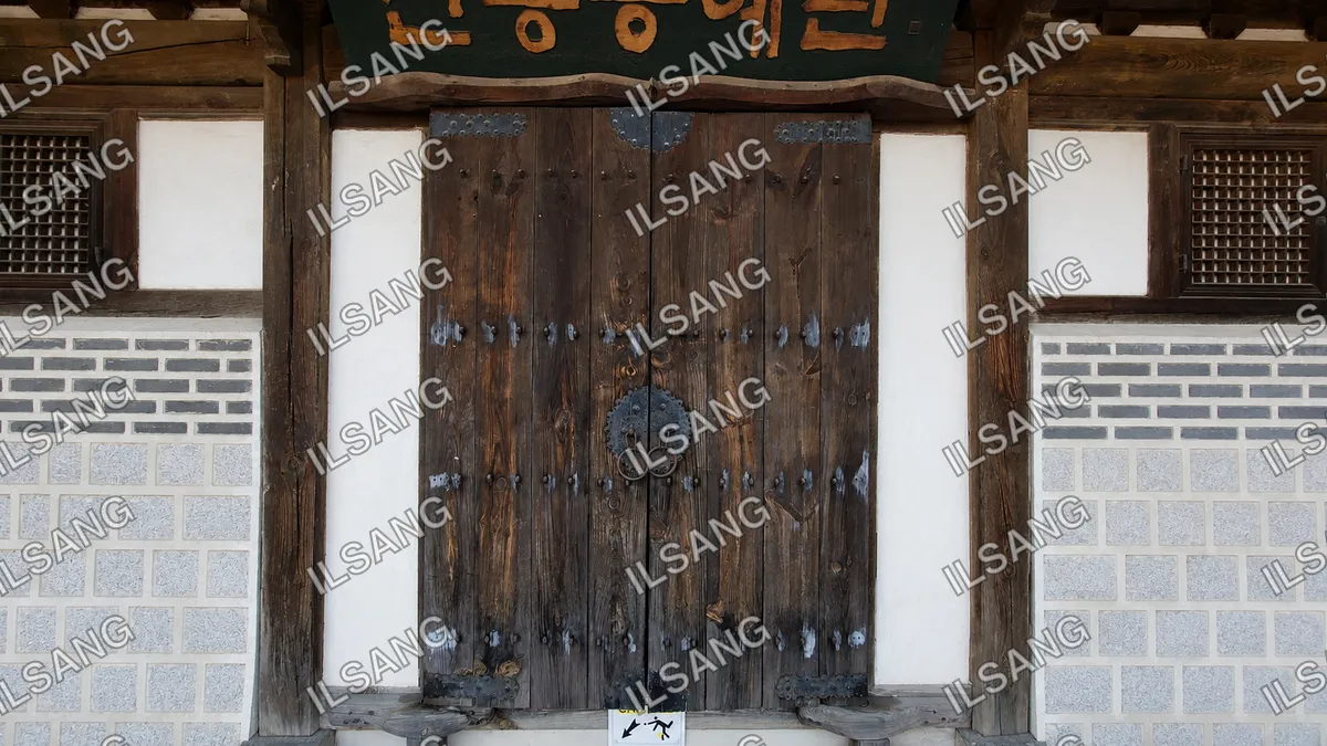 A wooden door with a sign on it.