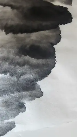 A black and white drawing of a cloudy sky