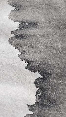 A black and white drawing of a wave