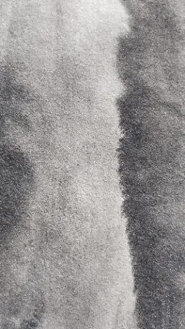 A black and white photo of a gray cloth with