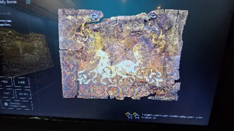 A broken piece of a wooden panel with a dragon