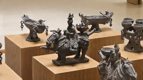 A collection of ancient statues, including a horse and a