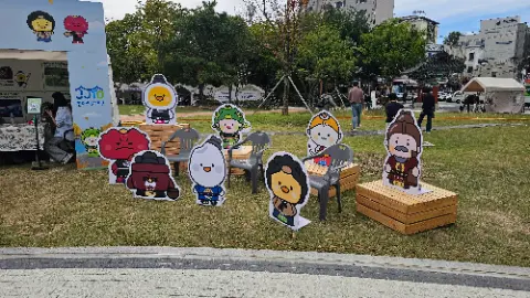 A collection of cartoon characters are displayed on a patio