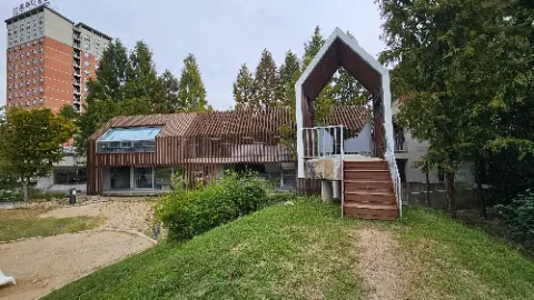 A house with a metal staircase leading to a door