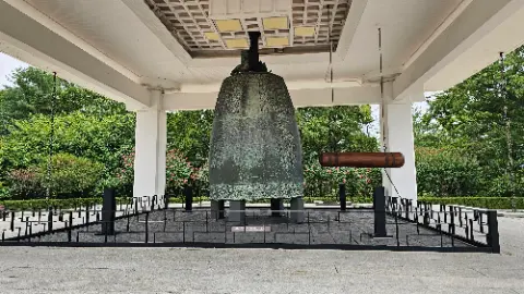 A large bell is on display in a building