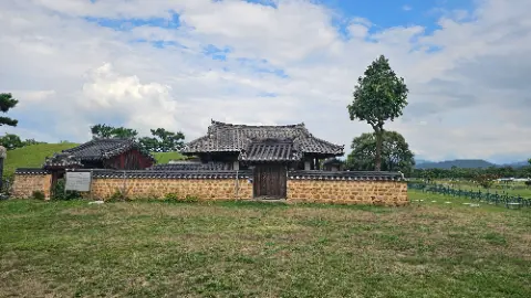A large brick building with a tree in front of