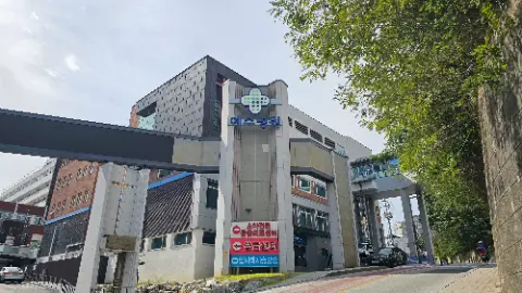 A large building with a cross on the top of