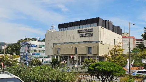 A large building with a sign on the front