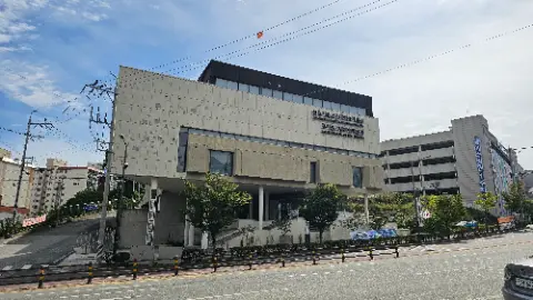 A large building with a sign on the side of
