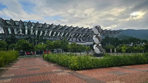 A large building with a statue in front of it