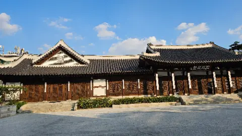 A large building with a tiled roof and many windows