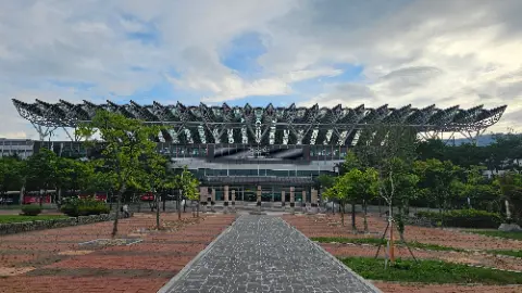 A large building with a walkway in front of it
