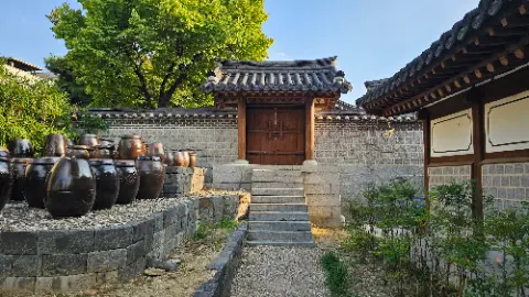A large building with a wooden door and a brick
