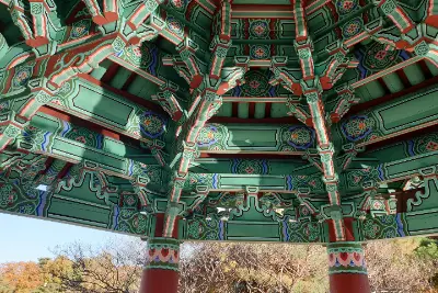 A large green and red wooden structure with a red