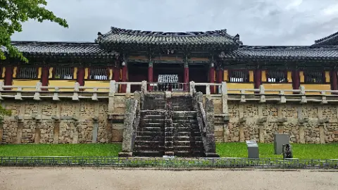 A large stone building with a staircase leading up to